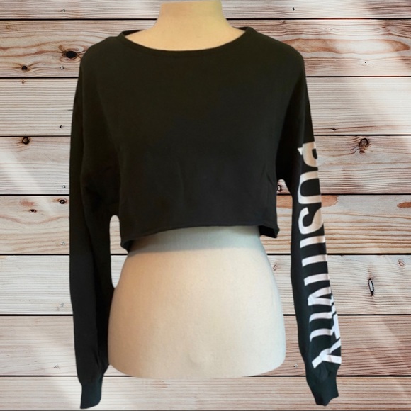 Divided Tops - Over sized small long sleeve crop top sleeve reads “Positivity”